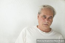Portrait of disappointed middle aged man in light shirt 5636V4