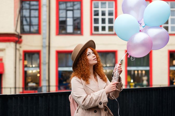 Woman outside with balloons