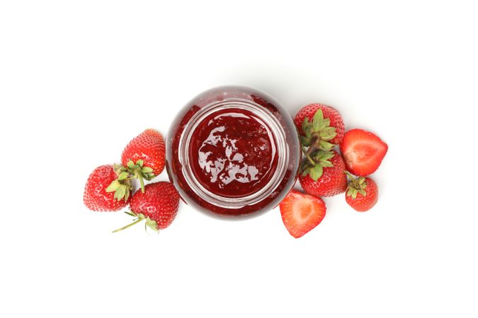 Delicious strawberry jam isolated on plain background