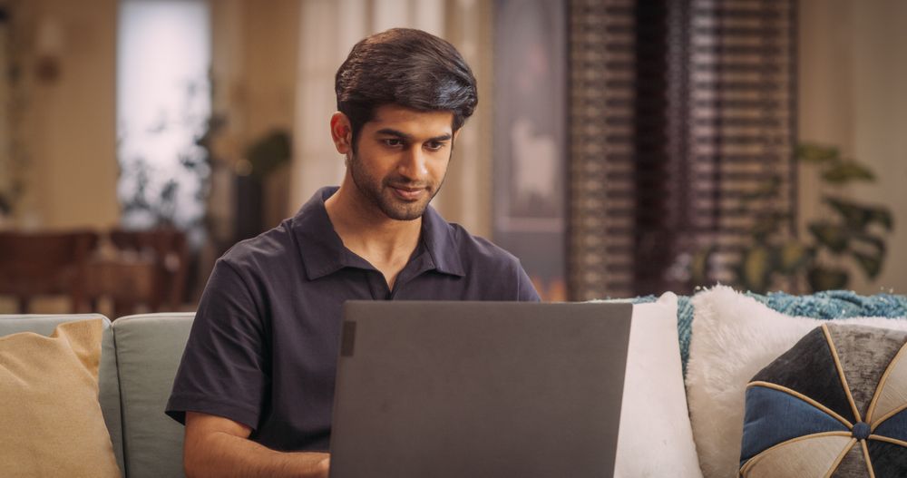 Successful Indian Man Focused on Remote Work as an Internet Entrepreneur