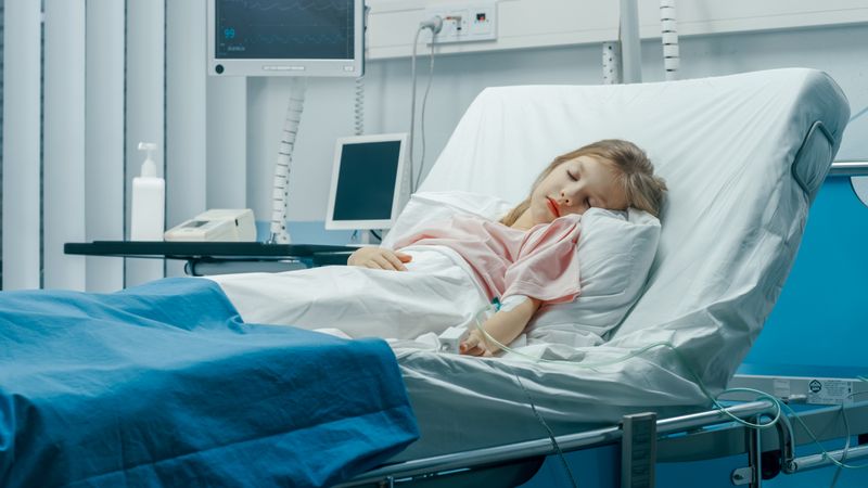 Cute Little Sick Girl Sleeps on a Bed in the Children's Hospital