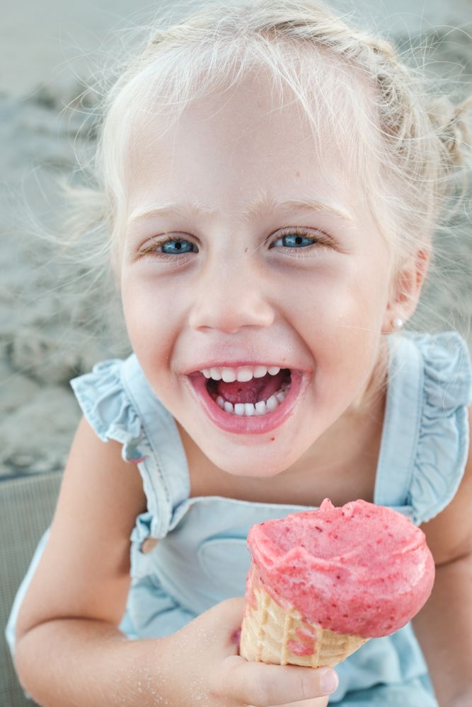 Carefree girl with ice cream in nature