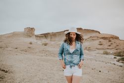 Female tourist walking on sandy quarry