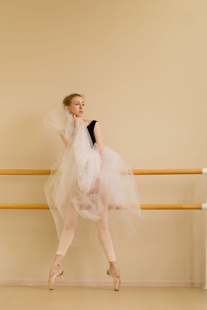 Ballet dancer poses elegantly in a dance studio