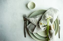 Daisy flowers on a summer table setting with copy space