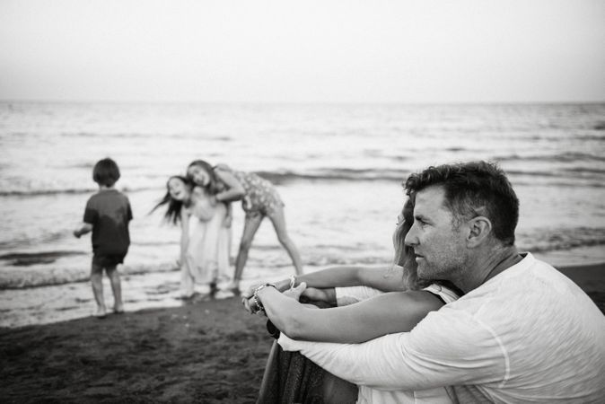 Beautiful happy family with children on beach