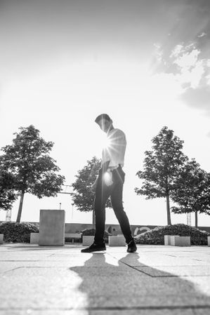 Stylish man on street in sunlight