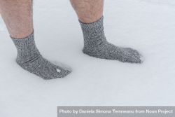 Close up of male feet in snow with socks 0JPyl4
