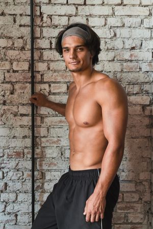 Muscular man posing in gym