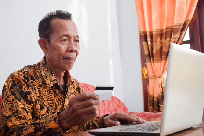 Male doing payment online with credit card