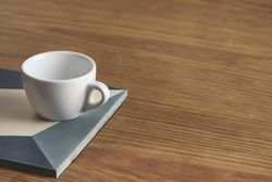 Empty coffee cup on wooden table