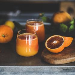Two glasses of freshly squeezed blood orange juice, close up, square crop