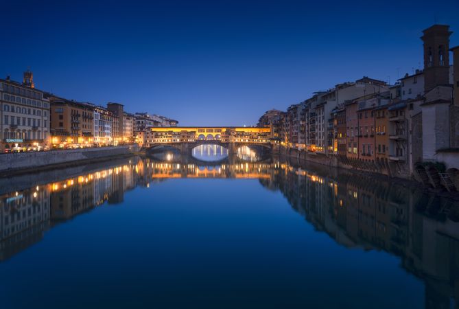 Ponte Vecchio bridge and Arno river in Florence at sunset, Tuscany, Italy