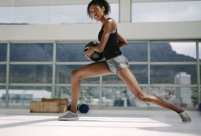 Fit woman working out with medicine ball