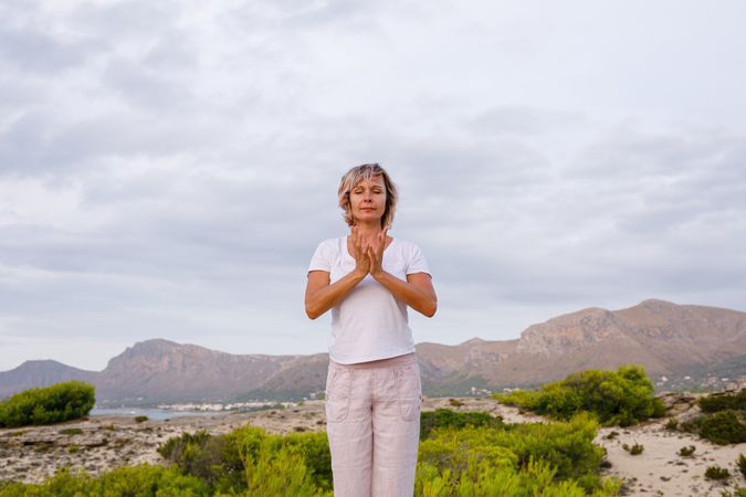 Adult woman doing breathing exercise
