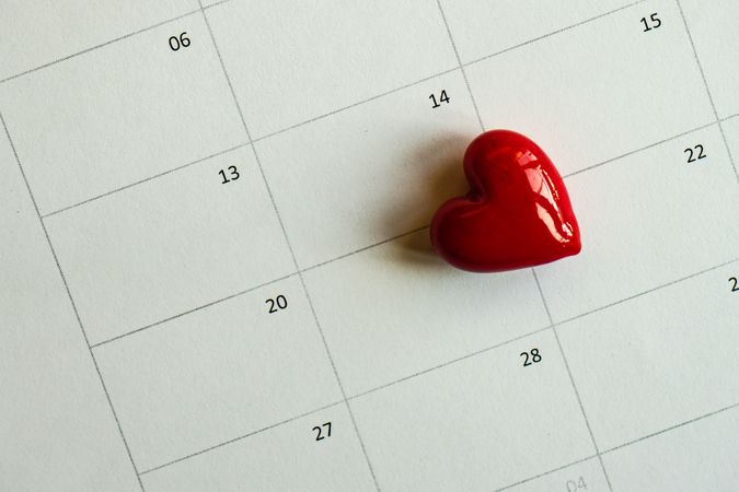 St. Valentine's Day card with heart ornament on calendar near the 14th