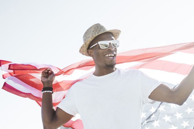 Cheerful black man with American flag