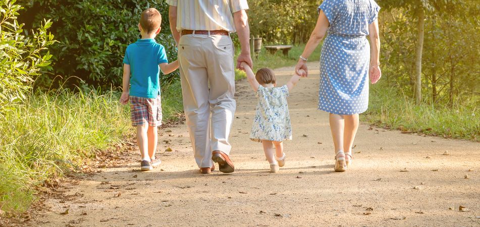 Grandparents and grandchildren walking outdoors