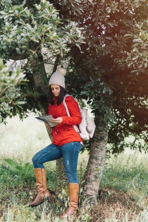 Female traveler with guide in countryside