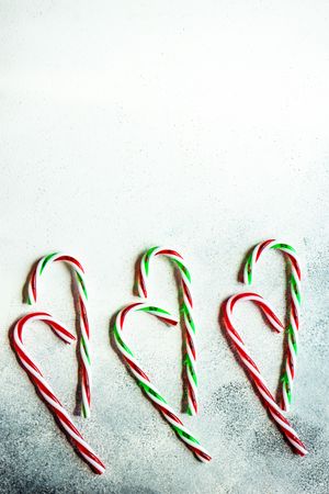 Christmas card concept with candy canes on counter