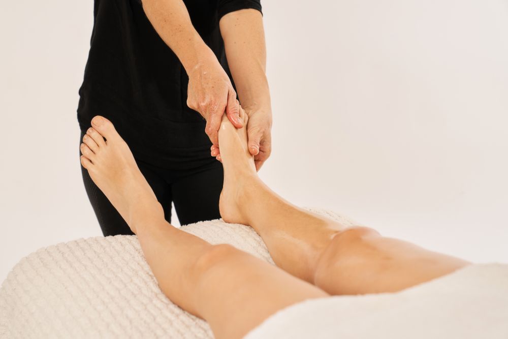 therapist massaging a woman's feet. Relaxing foot massage