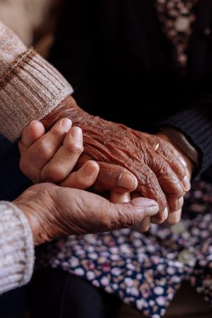 Detail of the hands of an mature couple