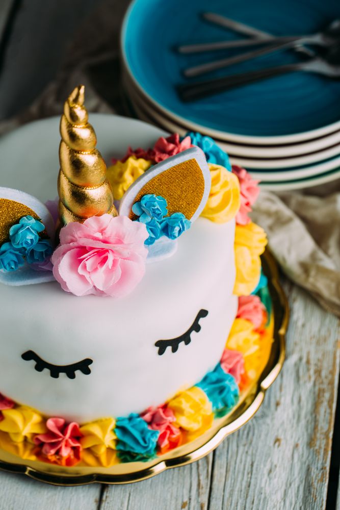 Cute unicorn cake with painted closed eyes