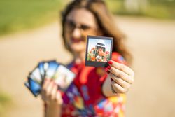 Young woman showing summer photos