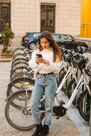 Smiling woman on rental bike