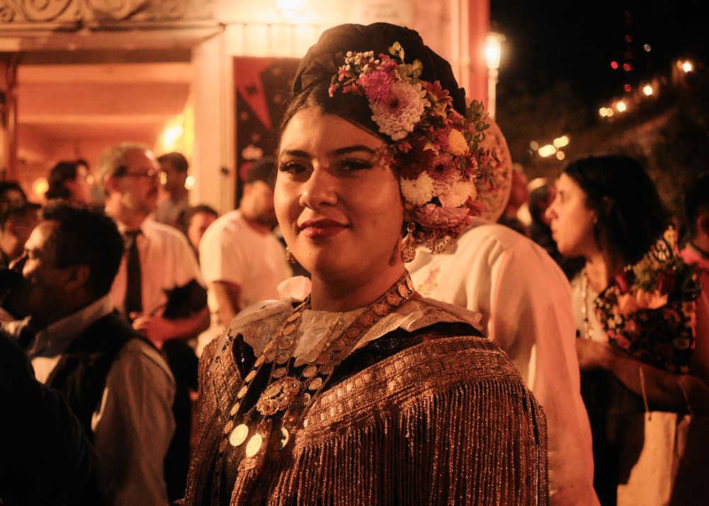 Woman with beautiful floral headpiece at street festival