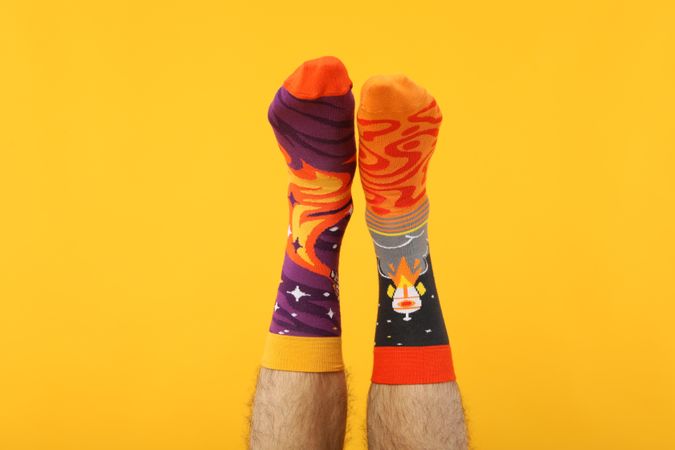 Casual clothes and wearing concept - socks, clothes for foot