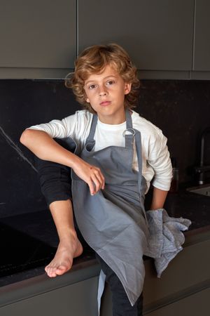 Cute boy on kitchen counter