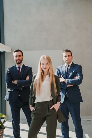 Business colleagues standing with crossed arms