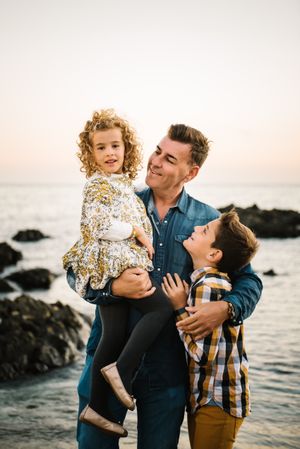 Father with her children at beach