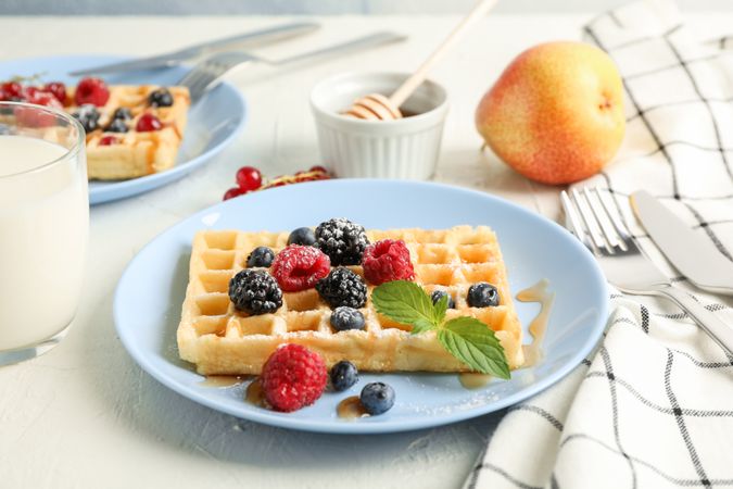 Composition of breakfast with belgian waffles, space for text