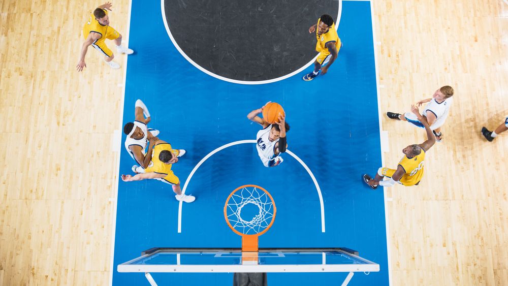 Top Down View of Talented Basketball Player Scoring Striking Slam Dunk Goal.
