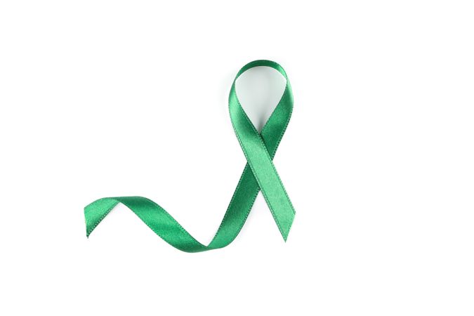 Green awareness ribbon isolated on blank background