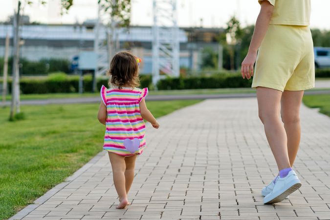 Toddler girl and mother on walk