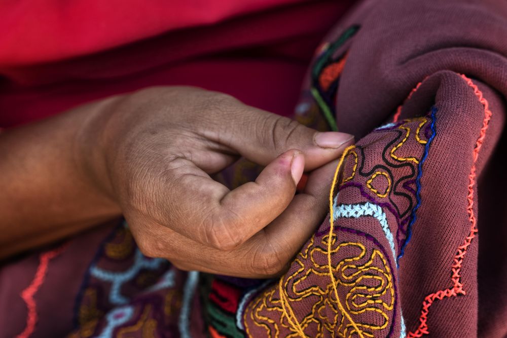 Person making traditional native San  Francisco Community embroidery in Pucallpa, Peru