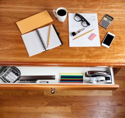 Cherry hardwood desk with personal income form and office supplies