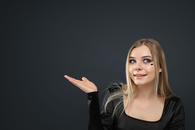 A woman with dark makeup for a Halloween party