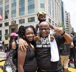 Smiling family at a anti racism protest in Washington, D.C.
