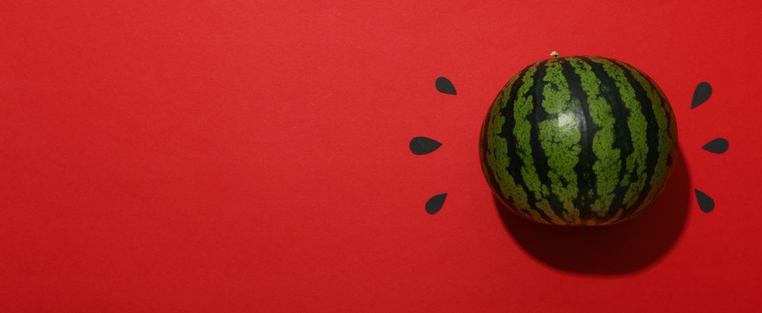 Ripe, juicy watermelon on a red background