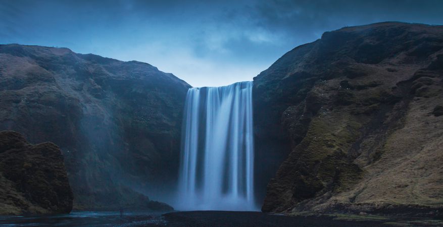 View of amazing waterfall on cloudy day