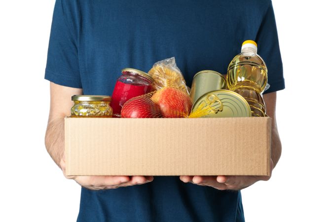 Man hold donation box, isolated on plain background