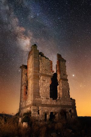 Ancient ruined building at night time