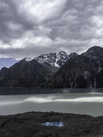 Landscape shot of overcast weather above calm lake in the mountains