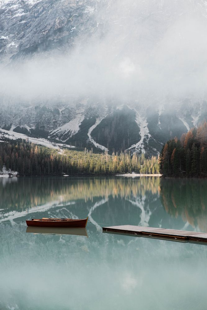 Beautiful lake with boast with mountains behind