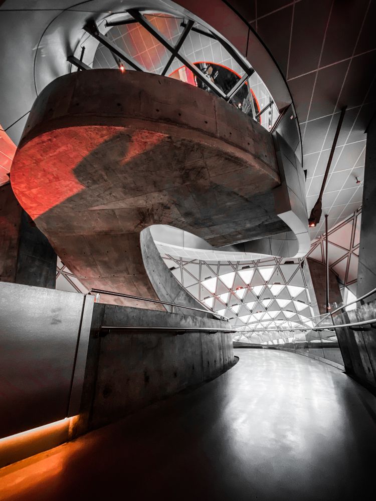 Grey Danish architecture with red light and shadows