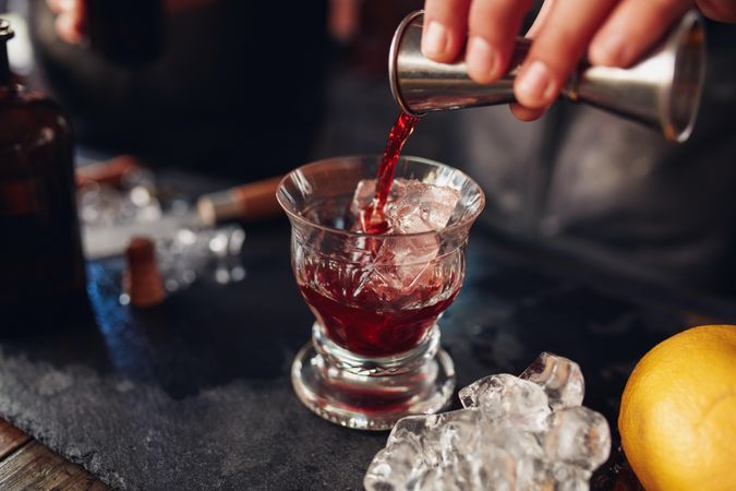 Negroni cocktail being poured